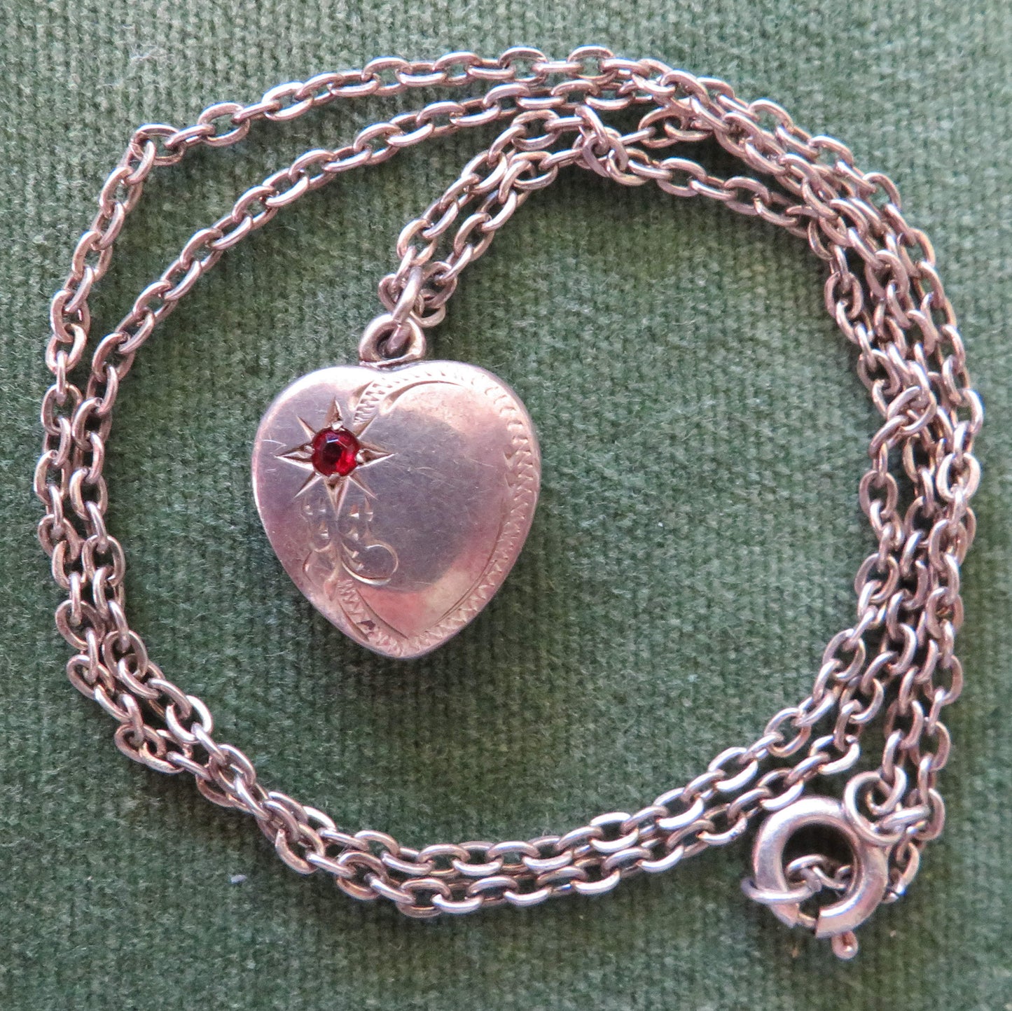Silver Heart Shaped Photo Locket Cameo Pendant Set With A Garnet With An Unmarked Chain