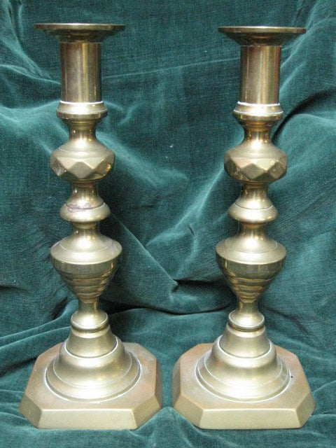 Pair of Late Victorian brass candlesticks with ejector rods