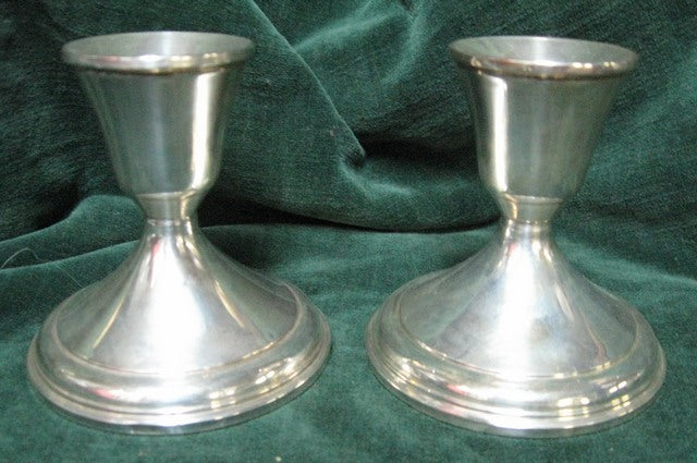 Silver candlesticks a pair with weighted bases manufactured in America