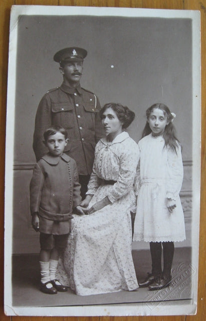 Postcard family portrait with British soldier & family