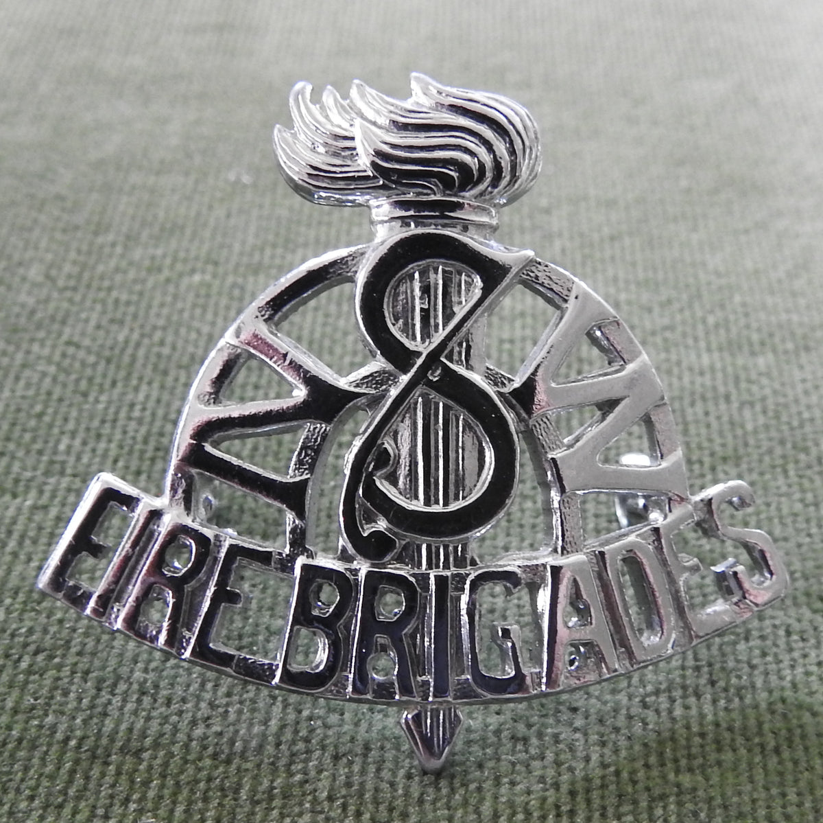 NSW Fire Brigade Chrome Plated Cap Badge In Good Condition With Lugs Intact (No Pins)