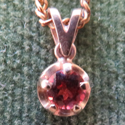 9ct Gold Garnet Pendant With A Plated Chain