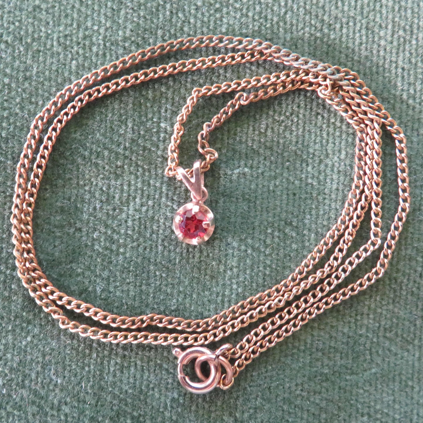 9ct Gold Garnet Pendant With A Plated Chain