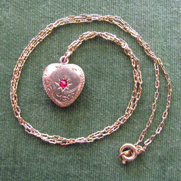 Rolled Gold Heart Shaped Photo Locket With A Red Stone And Unmarked Chain