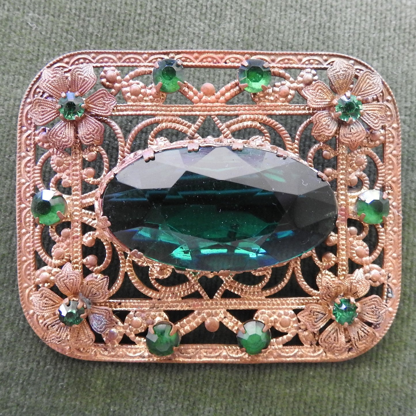 Gilt Metal Filigree Brooch Set with Green Stones