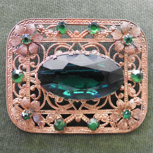 Gilt Metal Filigree Brooch Set with Green Stones
