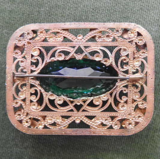 Gilt Metal Filigree Brooch Set with Green Stones