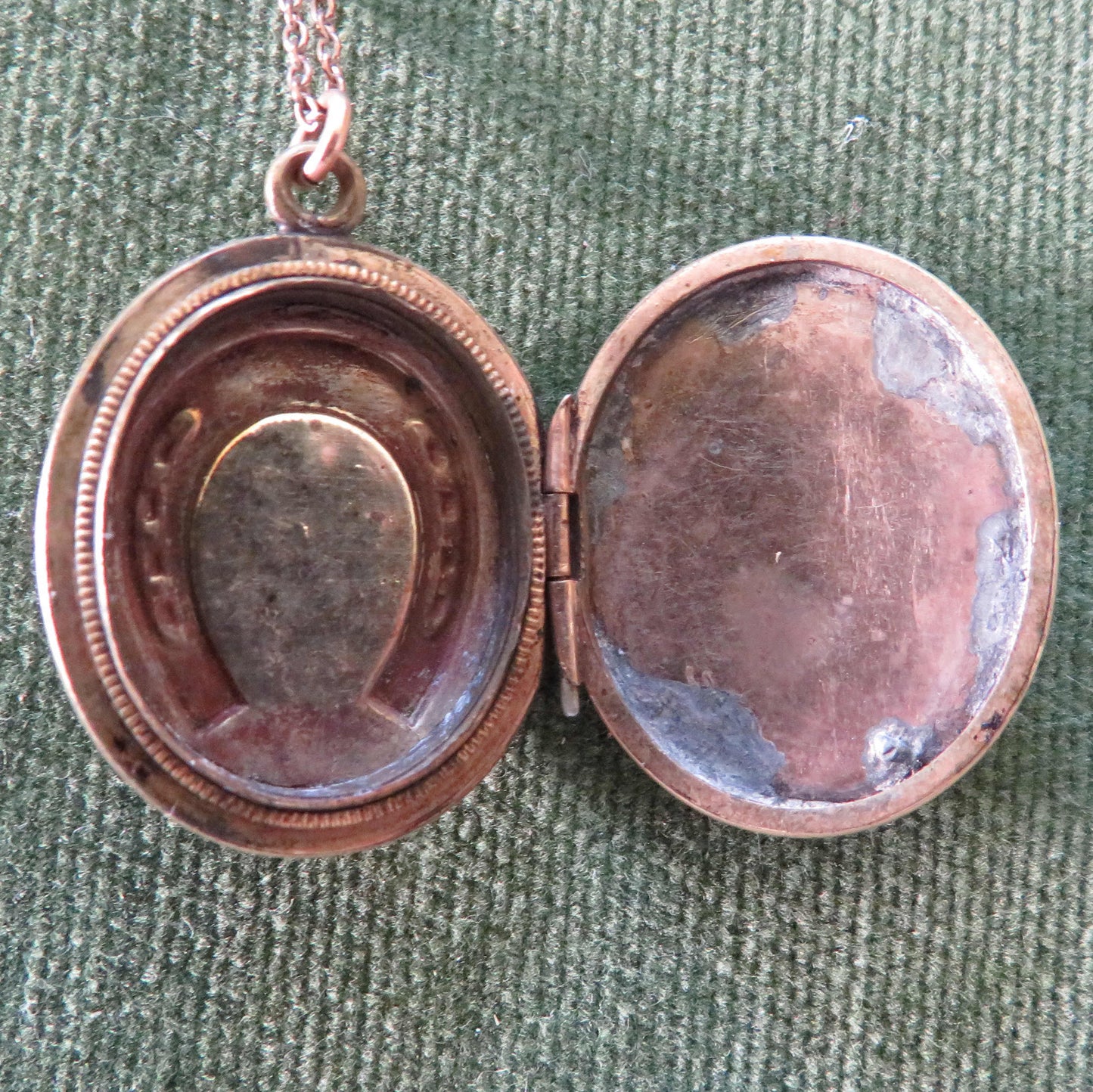 Unmarked Gold Oval Shaped Photo Locket Having A Horshoe Motif With Chain