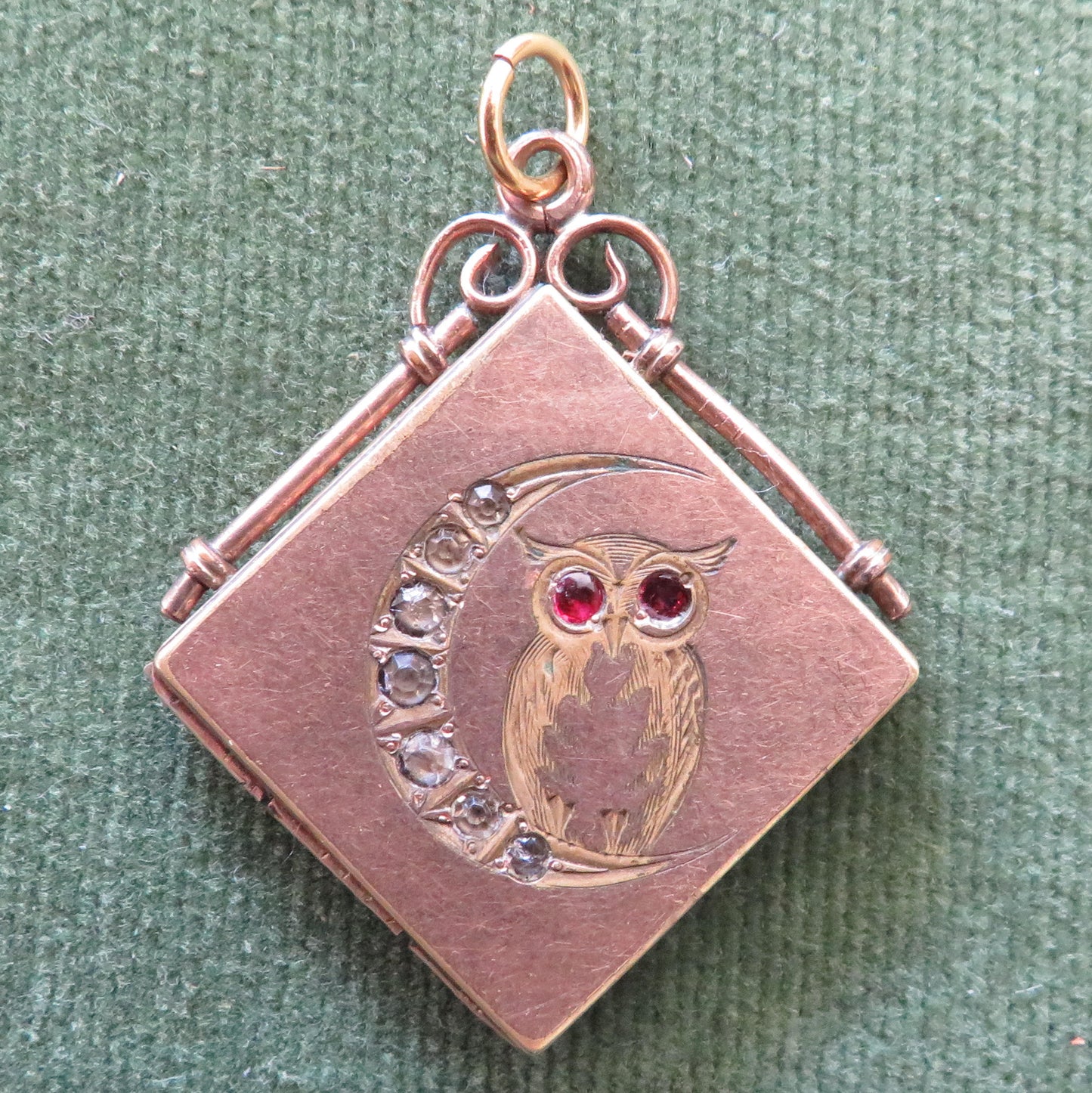 Rose Gold Plated Locket Set With Garnets And Clear Stones Depicting An Owl And Moon