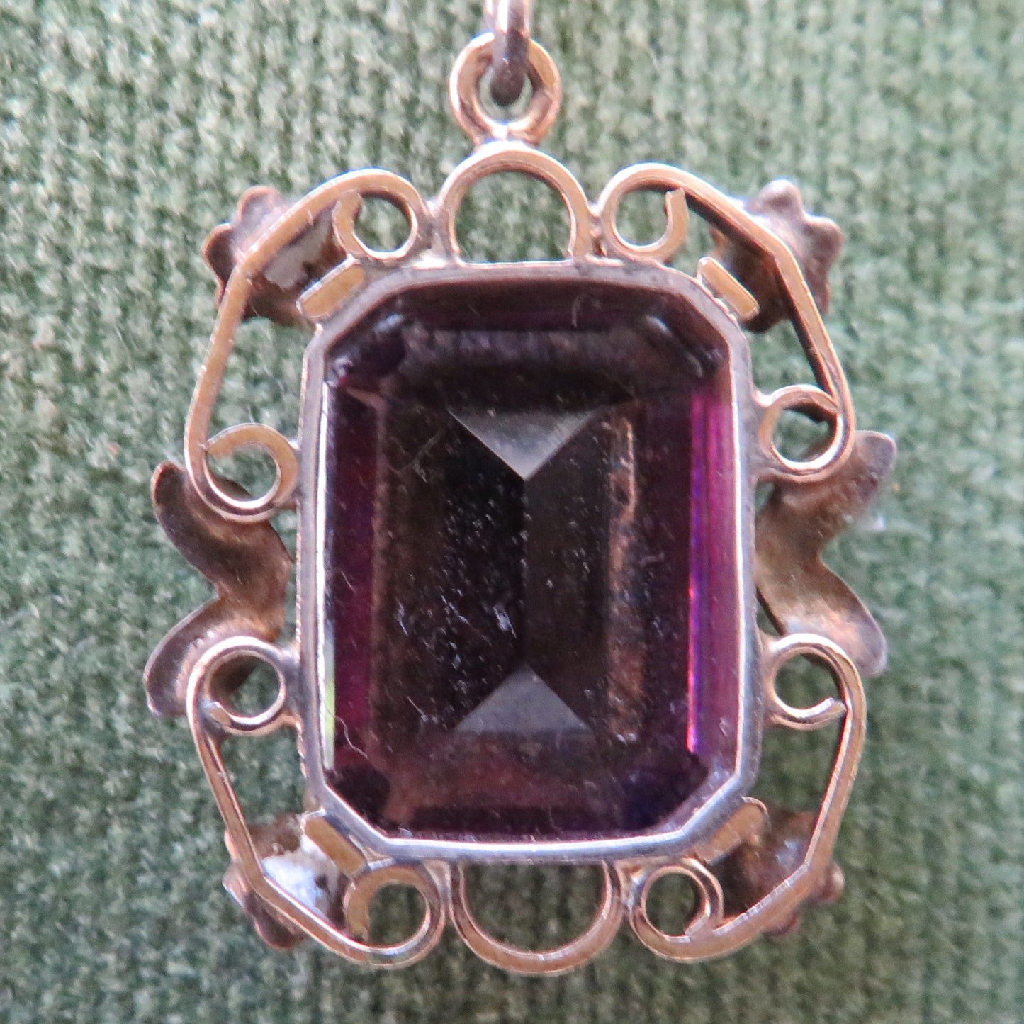 Gilt Foliate Decorated Pendant Having A Large Oblong Cut Wine Coloured Amethyst Simulate With Chain