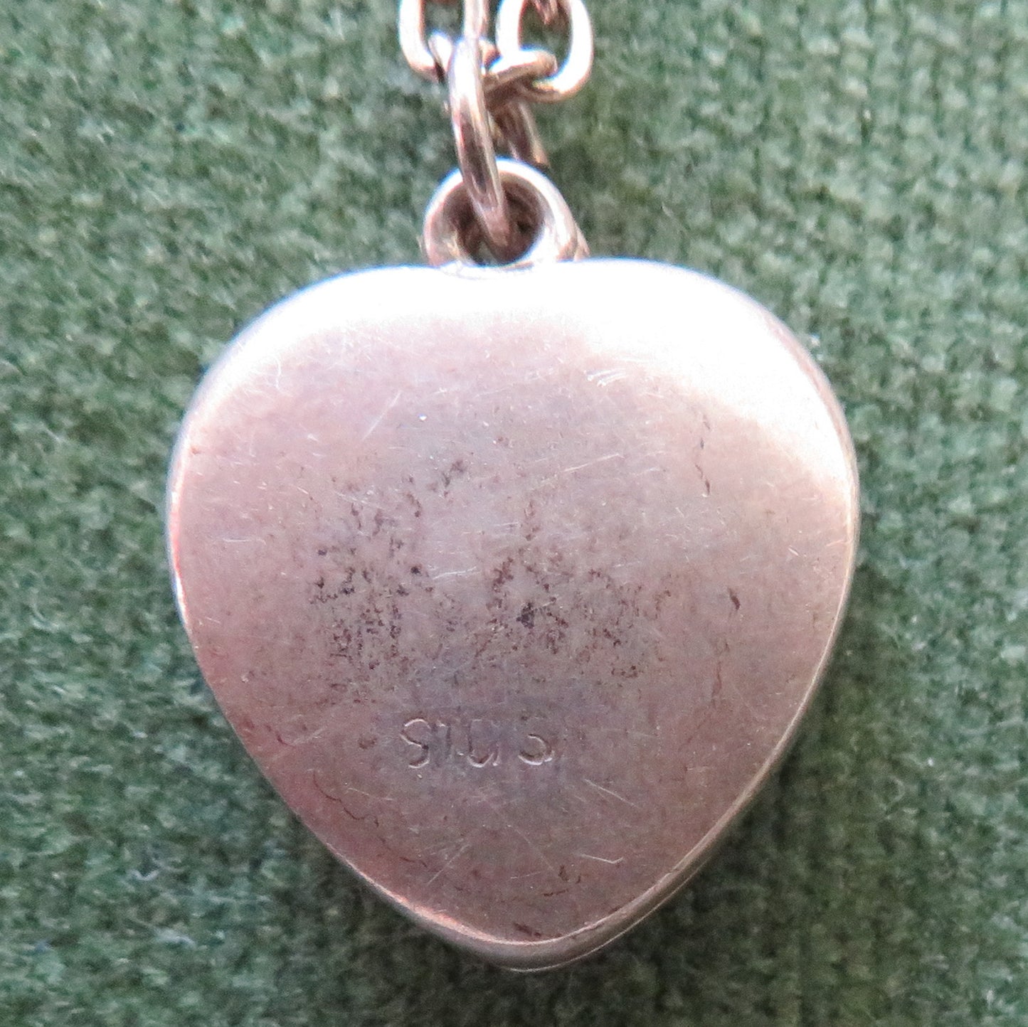 Silver Heart Shaped Photo Locket Cameo Pendant Set With A Garnet With An Unmarked Chain