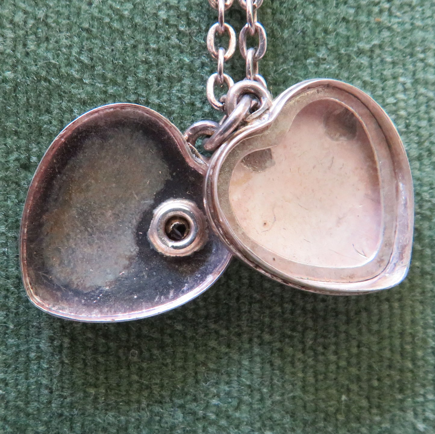 Silver Heart Shaped Photo Locket Cameo Pendant Set With A Garnet With An Unmarked Chain