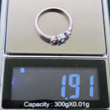 925 Sterling Silver Bezel Set Blue Topaz Dress Ring With 1 Clear Stone Either Side