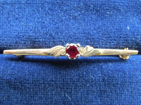 9ct Gold Bar Brooch Early Acanthus Decoration With A Claw Set Ruby