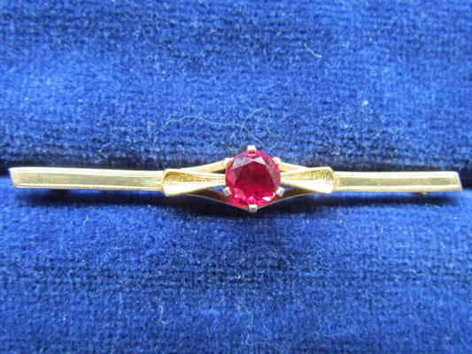 9ct Gold Bar Brooch With A Claw Set Ruby