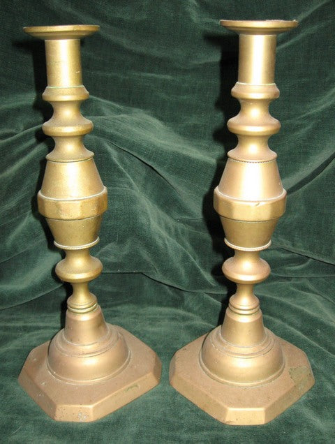 Pair of Late Victorian brass candlesticks with ejector rods