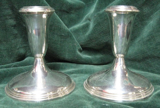 Silver candlesticks a pair with weighted bases manufactured in America