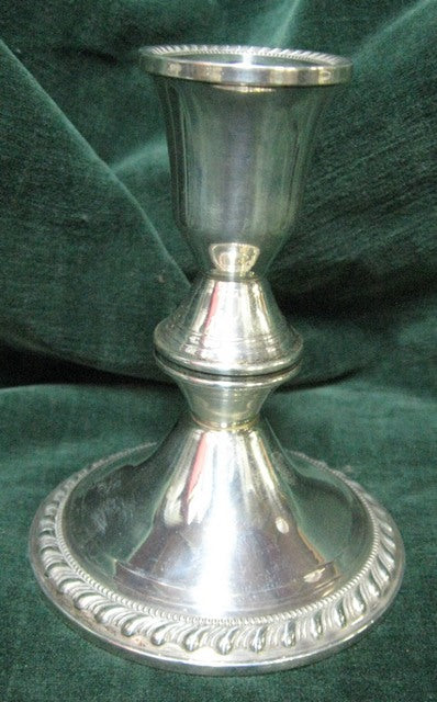 Silver candlestick with gadrooned weighted bases manufactured in America