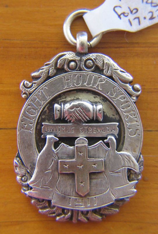 Sterling silver fob with gold overlayed Southern Cross depicting a kangaroo and emu with the inscription 'EIGHT HOUR SPORTS' 1911