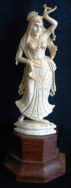 Ivory figure of a Dietie India late 19th century mounted on a rosewood base