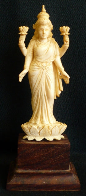 Ivory figure of Lord Vishnu standing on a Lotus flower India late 19th century mounted on a rosewood base