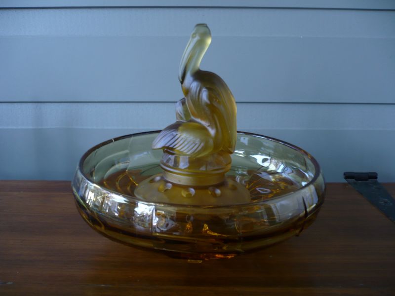 Table centre / float bowl of pelicans hudling in frosted & amber glass