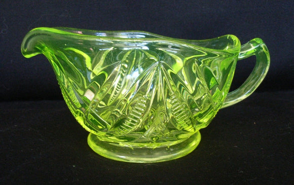 Yellow / green citrine / Citroen / uranium glass jug with footed molded body
